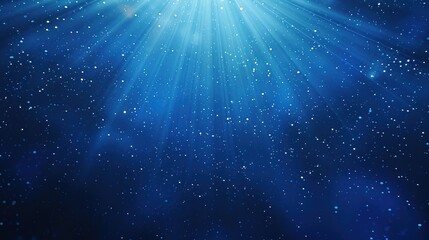 Rays of light with sparkling particles and soft bokeh effects of cosmic universe on dark blue background. Ideal for science, astronomy and creative projects