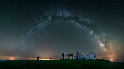 Group of photographers capture the Milky Way over the abandoned buildings at the top of Picon...