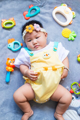 Baby in cute outfit with toys,Little girl 3-6 months old in cute outfits 