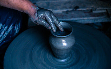 closeup view of potter at work in Nepal.