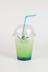 Refreshing summer drink. Colored lemonades,mojito, strawberry in plastic cups with ice. Take away drinks.