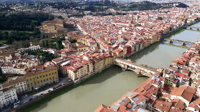 Orbit aerial view overlooking the bridges and Arno river, Florence, Tuscany, Italy