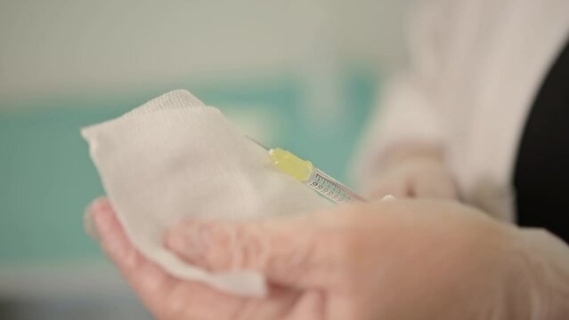 Applying ointment on gauze for wound treatment