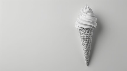   A white ice cream cone atop a pristine table, adjacent to a cupcake nestled on a plate