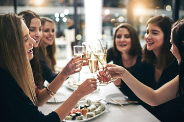 Women, friends and celebration with champagne in restaurant for toast, sushi and dinner together....