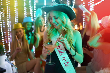 Woman, party and bride alcohol in club, bachelorette event and celebration at night rave. Female person, cocktail and drinking at happy hour for fun, confident and festival aesthetic for freedom