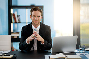 Portrait, confidence and business man in office on laptop at table for corporate job in Switzerland. Face, consultant and professional entrepreneur at desk, employee or worker in suit at company