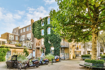 Quaint urban street with apartments and greenery