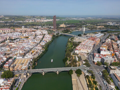 Aerial view of Seville landmarks along the Guadalquivir River