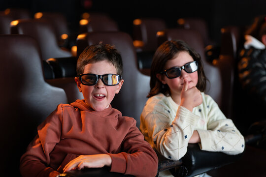 Summer movie time: Kids enjoying a 3D film in cinema