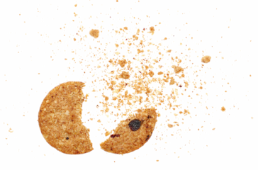 Broken wholegrain biscuit with rolled oats and fruit, crumbs isolated on white