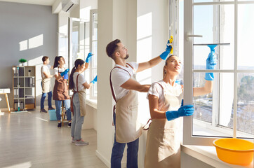 Cleaner group window washing with squeegee, working, professional janitor service busy completing cleaning tasks at home, office. People employed to take care of room, company maintaining washing 