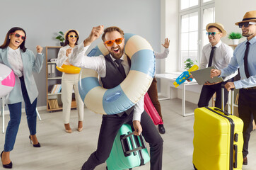 Lively office colleagues is eagerly awaiting approach of summer vacation season. Colleagues with accessories for beach holiday are ready for well-deserved rest from hustle and bustle of corporate life