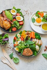 Vegetable plates with meat, fish and eggs. Complete diet for the day. Various breakfasts, lunches, snacks. Time to eat healthy foods. Eating by the hour. Health concept.
