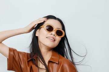 Woman lifestyle portrait hair asian beautiful glamour sunglasses fashion beige beauty vacations model