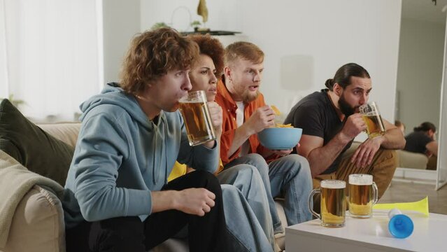 Group of fans watching sport match on tv, celebrating goal of favorite team. Europe Sport Soccer Fans 2024. 2026 USA, Canada, Mexico. Football, sports and soccer fans. Paris Games, Slow Motion