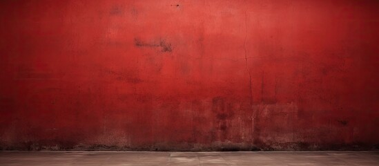 A room with red walls and concrete floor