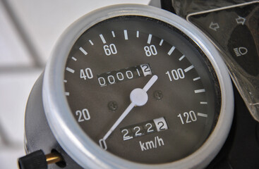 round motorcycle speedometer close-up. classic looking speedometer