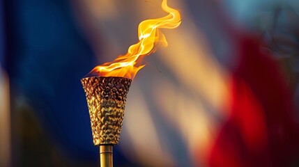 Close-up of the olympic torch lit with a vibrant flame, representing the spirit of the games