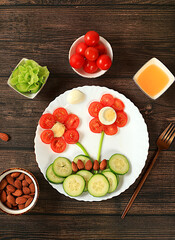 Healthy breakfast with ingredients, fun food for children, ideas for dish decoration, Healthy and natural food concept. Flower of tomatoes, cucumbers and eggs on a plate,