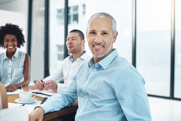 Portrait, businessman and smile at meeting, boardroom and colleagues for mature man, office and...