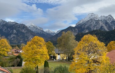 Bavarian Alps with Bright Yellow Fall Leaves and Cloudscape