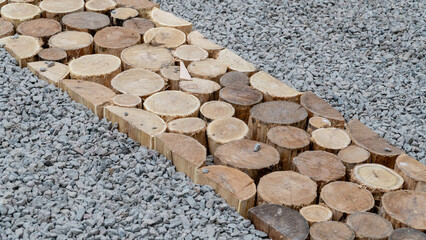 Construction of a decorative walkway pavement  from natural  wooden stamps. - 797030286