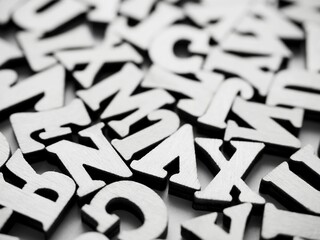 Monochrome poster with close-up of a pile uppercase letters background. Capital letters background...