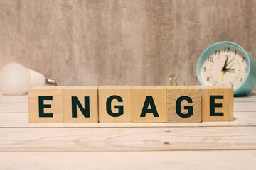 engagement word written on wood block. engagement text on table, concept.