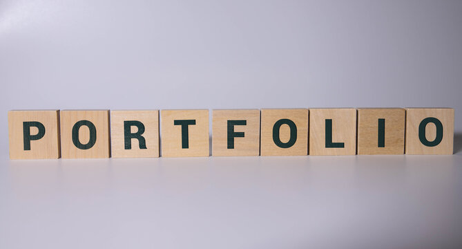 portfolio word in vintage letterpress wood type on a grunge painted.