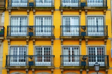 Close-up of traditional apartment building with blue tiles facade. Beautiful simple AI generated image in 4K, unique.