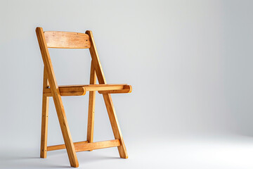 A wooden ladderback chair isolated on a clean white surface.