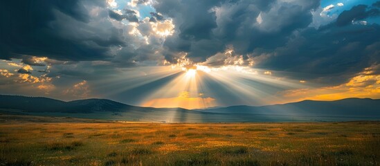 Obraz premium Sun Shining Through Clouds Over Field