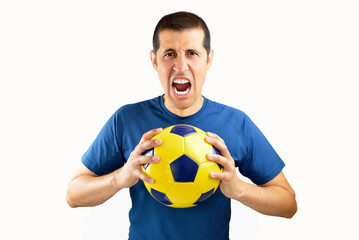 Man holding soccer football ball over isolated white background screaming proud and celebrating victory and success very excited, cheering emotion