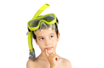 Pensive boy with snorkel mask tuba and snorkel looks away thinking isolated on a white background, funny kid lips hold finger near mouth,conceptual image.Snorkeling, swimming,vacation concept.