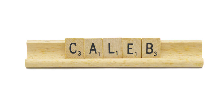 Miami, FL 4-18-24 popular baby boy first name of CALEB made with square wooden tile English alphabet letters with natural color and grain on a wood rack holder isolated on white background