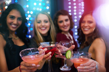 Women, group and cocktail with toast for portrait at nightclub, event or happy hour together....