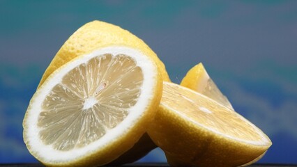 A slice of lemon, bright yellow and vibrantly citric, lies exposed. The yellow flesh, with...