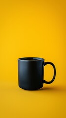 Black coffee mug on a vibrant yellow background