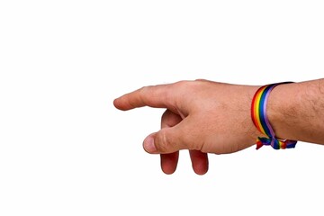 Close-up of a hand wearing a rainbow bracelet, representing LGBTQ+ pride and diversity on a white...