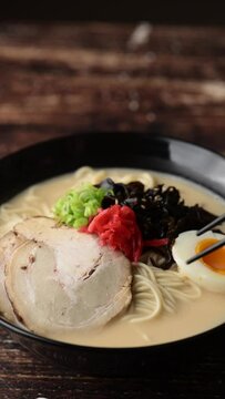 Japanese Tonkotsu style ramen in black bowl