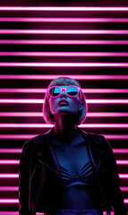 Woman in sunglasses with neon pink light background. Futuristic portrait with blonde hair and retro vibe
