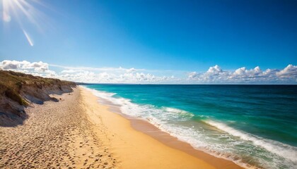 blue sky over a beach with golden shore and turquoise water