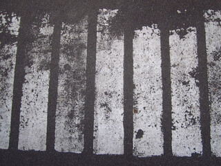 Faded zebra crossing, pedestrian marked crosswalk on an asphalt city road top view. - obrazy, fototapety, plakaty