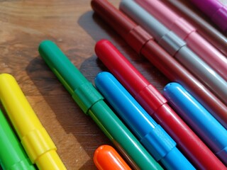 Makers, back to school concept. Markers on the desk. 