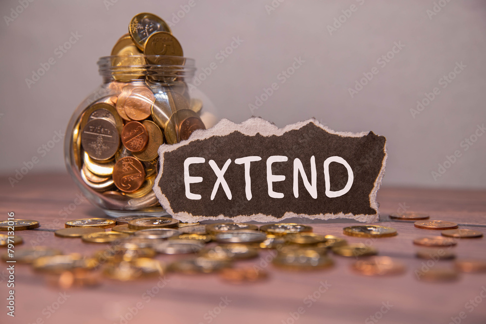 Poster deadline extended text on a notepad on chart with keyboard and calculator on grey background