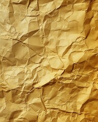 Textured background of crumpled golden paper