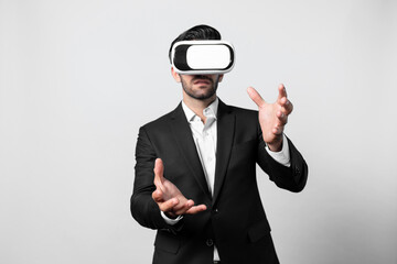 Smart business man with suit holding something while VR goggle to connect metaverse. Professional project manager looking at hologram by using visual reality headset. Technology innovation. Deviation.