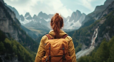 Adventurous traveler looking at mountainous landscape