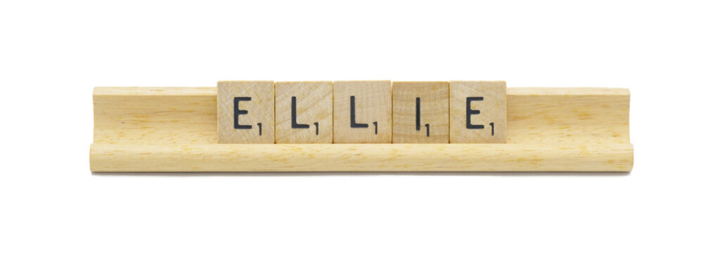 concept of popular newborn baby girl first name of ELLIE made with square wooden tile English alphabet letters with natural color and grain on a wood rack holder isolated on white background